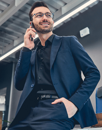 smiling business man making call by mobile QTFFSUA 1